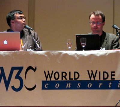 Rohit Kare speaking, Hakon Lie to right