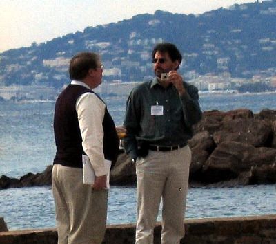 Michael Sperberg-McQueen and Norman Walsh talking on the beach
